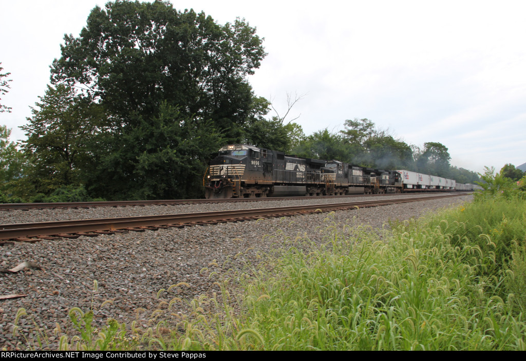 NS 9856 takes a westbound past MP 116